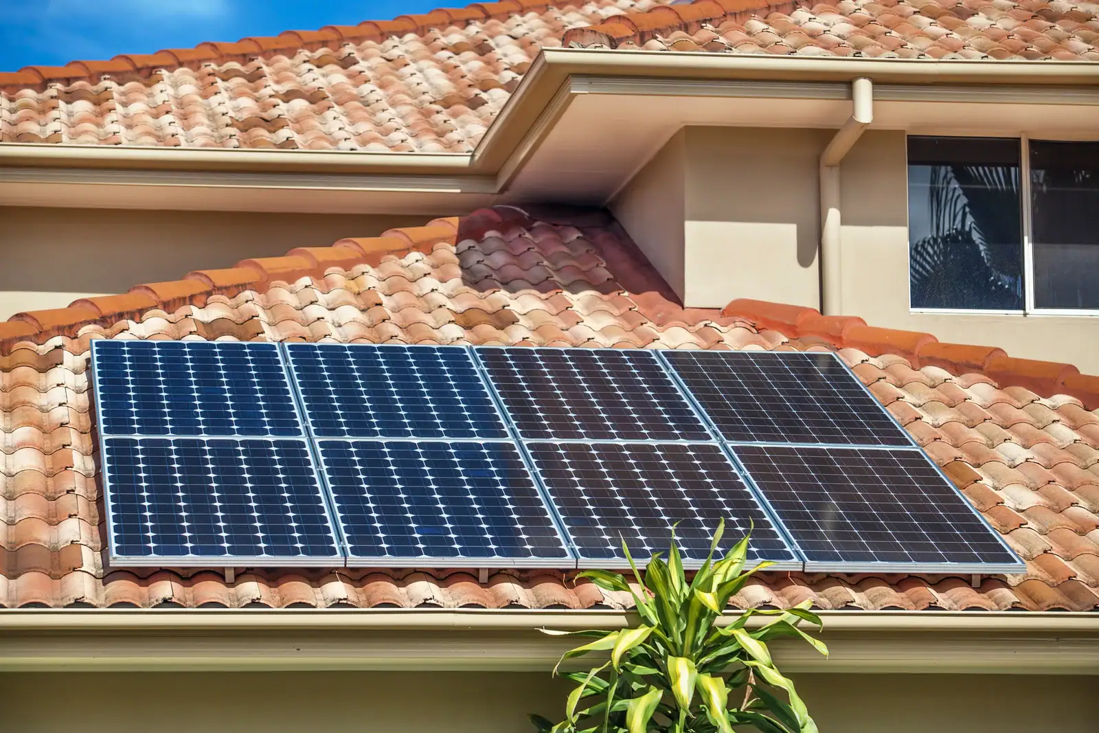 image of 8 solar panels on rooftop during the day